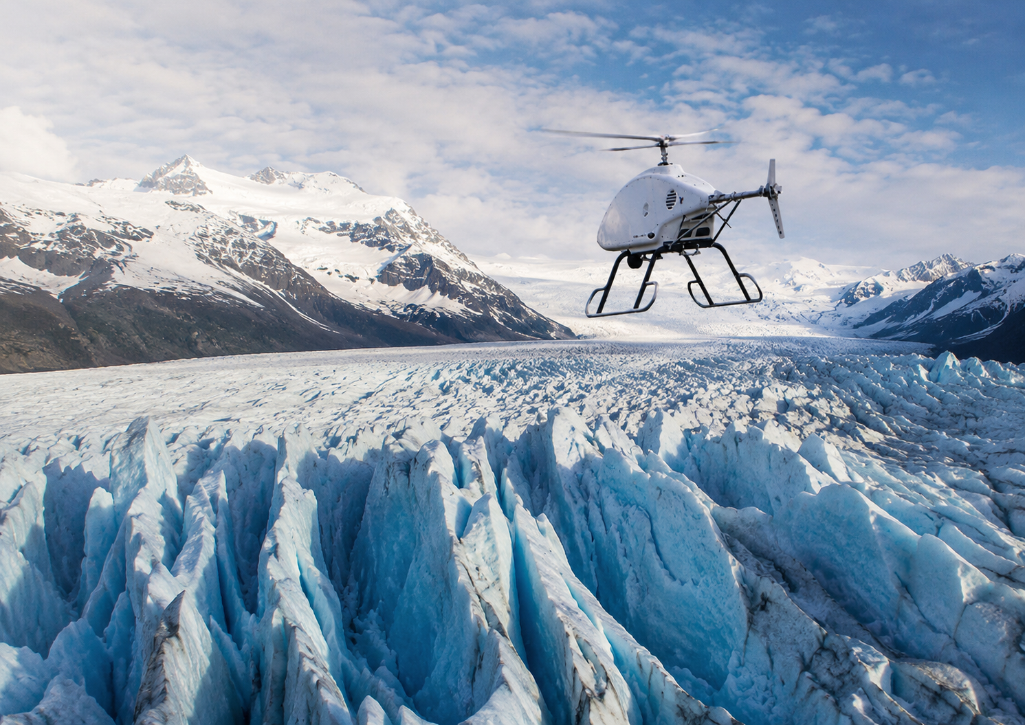 Turbine-variant Aeolus UAS flying over a glacier at high altitude
